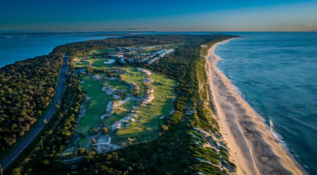 Pullman Magenta Shores Resort Entrance Exterior photo Aerial view of the golf course