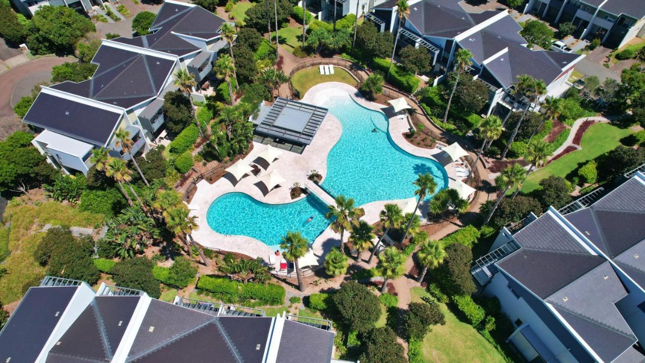 Pullman Magenta Shores Resort Entrance Exterior photo Aerial view of the pool at the clubhouse
