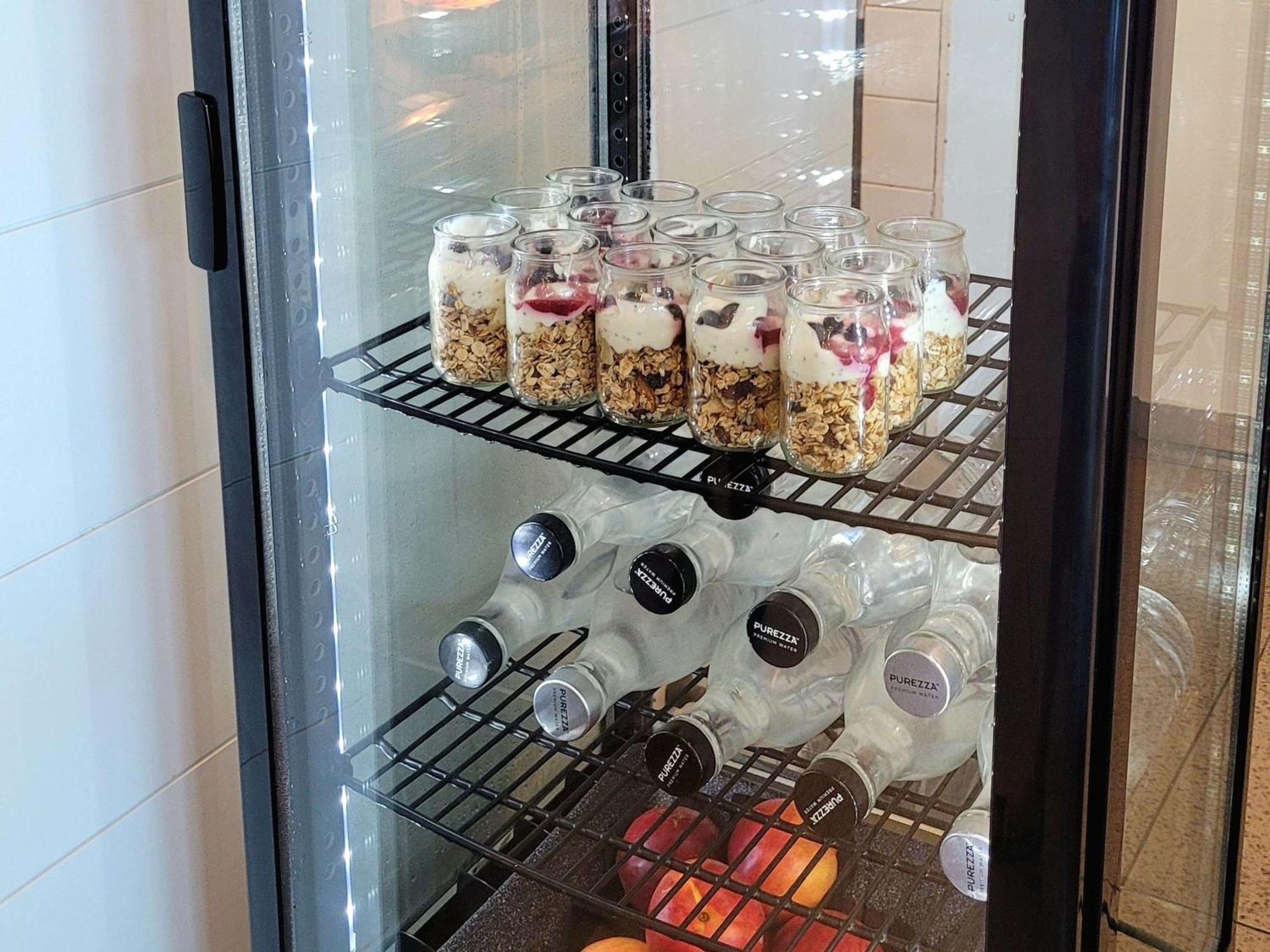 Pullman Magenta Shores Resort Entrance Exterior photo A glass door refrigerator